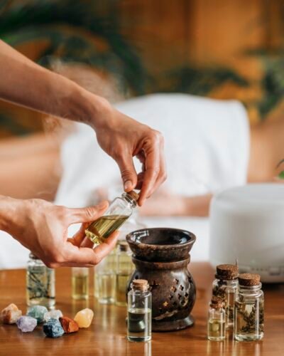 Ayurveda Aromatherapy Massage, Pouring Aromatic Oil in Essential Oil Diffuser