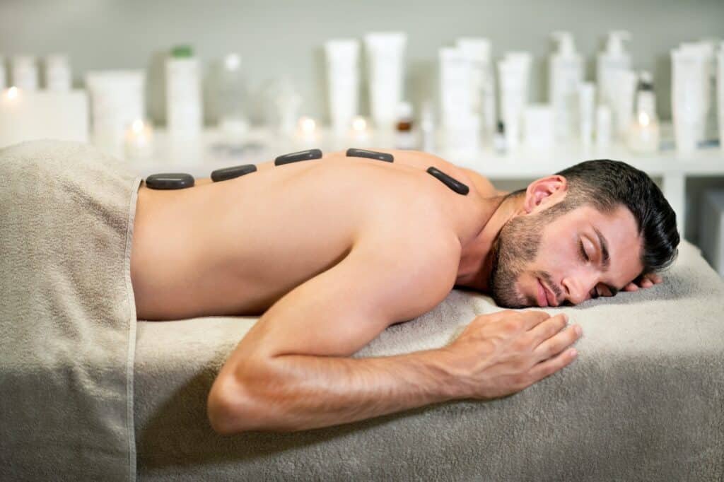 Man enjoying hot stone massage